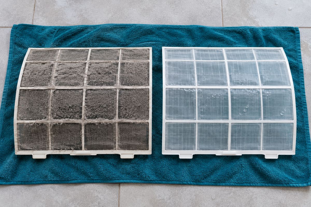Two aircon filters side by side: one clogged with grey dust, one washed clean